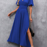 Eterna | Elegantna dugačka haljina u crnoj boji s V izrezom, prozirnim rukavima i otvaranjem