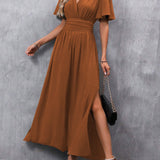 Eterna | Elegantna dugačka haljina u crnoj boji s V izrezom, prozirnim rukavima i otvaranjem