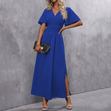 Eterna | Elegantna dugačka haljina u crnoj boji s V izrezom, prozirnim rukavima i otvaranjem